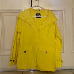 Yellow hooded NorthFace rain jacket